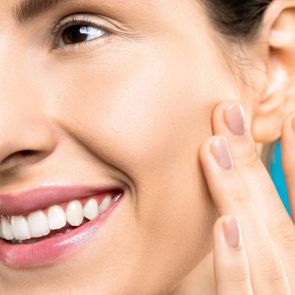 A woman enjoying healthy, radiant skin